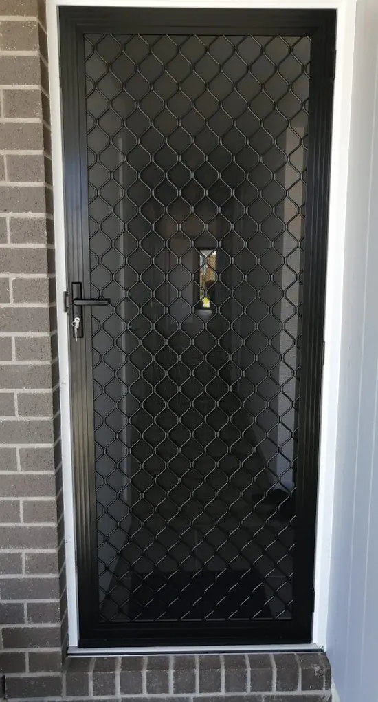 hinged security door with black diamond grille