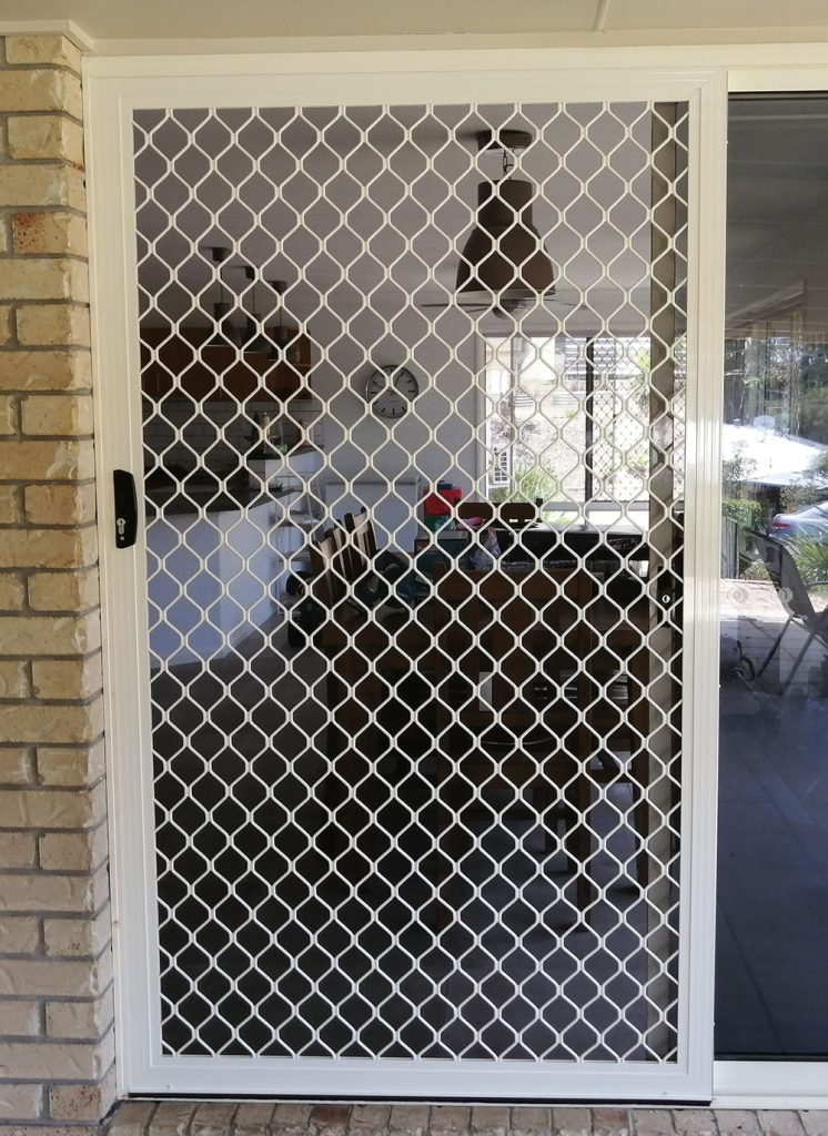 white sliding security screen door